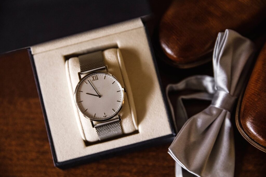 White dial analog watch inside box